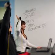Travel Gym Portable Gym System | Workout at Work | Two people doing seated military press at office table with the Travel Gym System while working